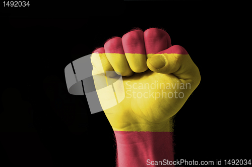 Image of Fist painted in colors of spain flag