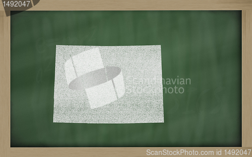 Image of outline map of colorado on blackboard 