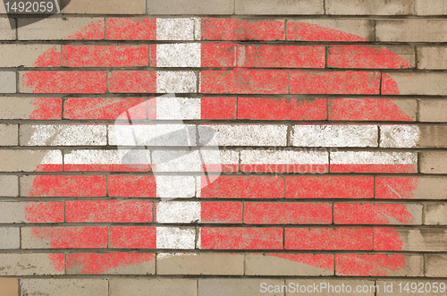 Image of flag of denmark on grunge brick wall painted with chalk  