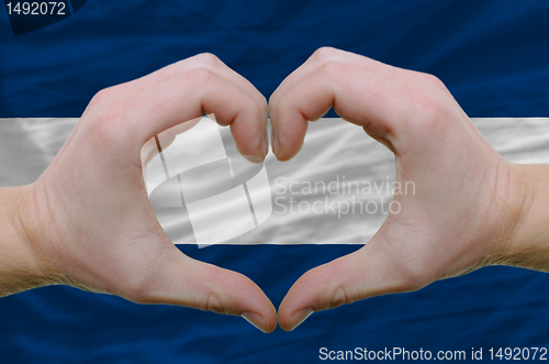 Image of Heart and love gesture showed by hands over flag of nicaragua ba