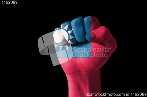 Image of Fist painted in colors of taiwan flag