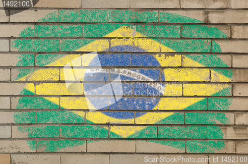 Image of flag of Brazil on grunge brick wall painted with chalk  