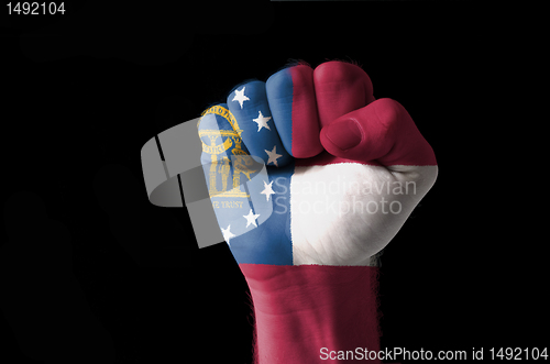 Image of Fist painted in colors of great georgia flag