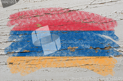 Image of flag of armenia on grunge wooden texture painted with chalk  