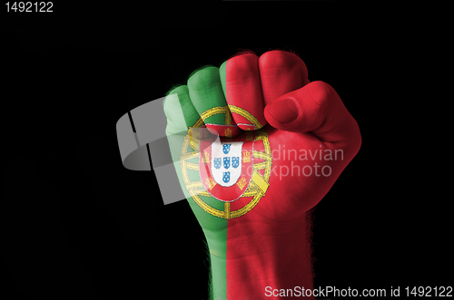 Image of Fist painted in colors of portugal flag