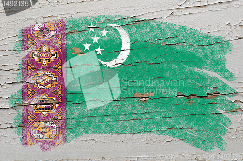 Image of flag of turkmenistan on grunge wooden texture painted with chalk