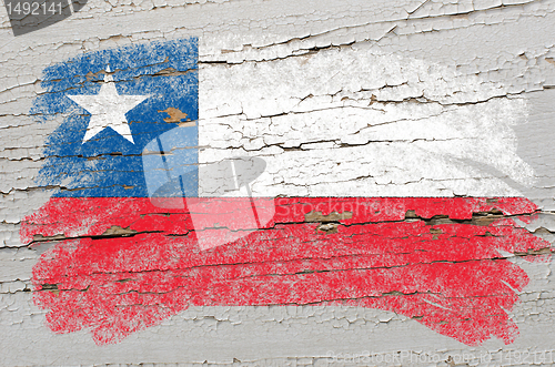 Image of flag of chile on grunge wooden texture painted with chalk  