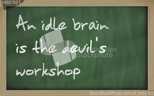 Image of " An idle brain is the devil's workshop " written on a blackboar