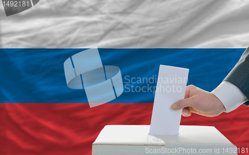 Image of man voting on elections in russia