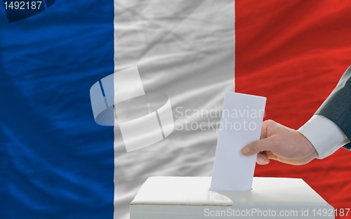 Image of man voting on elections in france