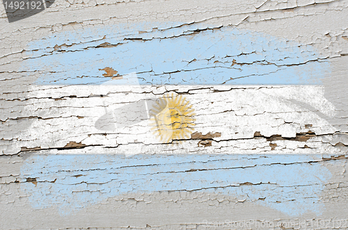 Image of flag of Argentina on grunge wooden texture painted with chalk  