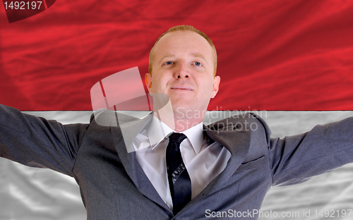 Image of happy businessman because of profitable investment in indonesia 