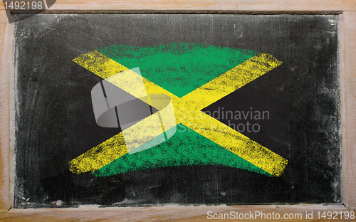 Image of flag of Jamaica on blackboard painted with chalk  