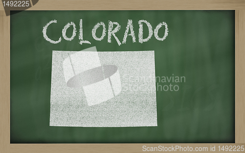 Image of outline map of colorado on blackboard 