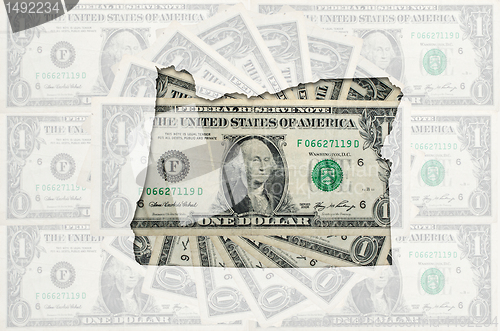 Image of Outline map of oregon with transparent american dollar banknotes
