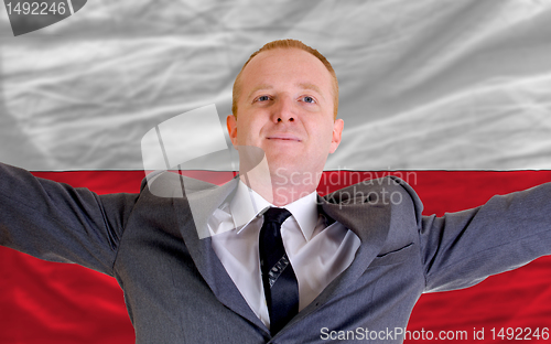 Image of happy businessman because of profitable investment in poland sta