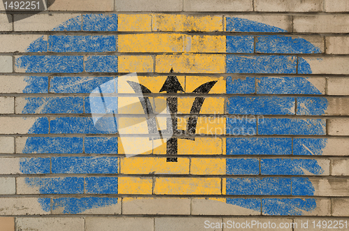 Image of flag of Barbados on grunge brick wall painted with chalk  