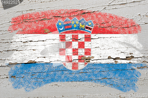 Image of flag of Croatia on grunge wooden texture painted with chalk  