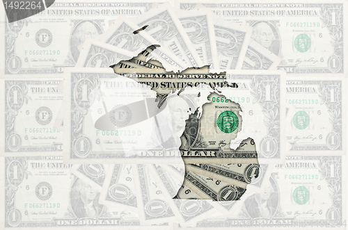 Image of Outline map of michigan with transparent american dollar banknot