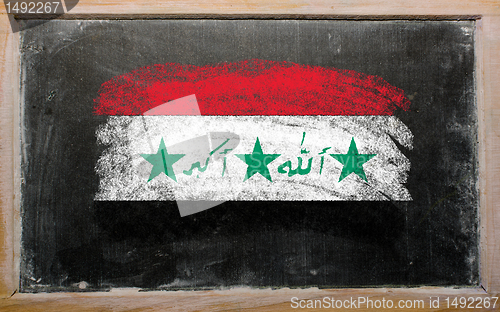 Image of flag of Iraq on blackboard painted with chalk  