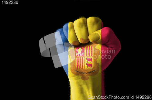 Image of Fist painted in colors of andora flag