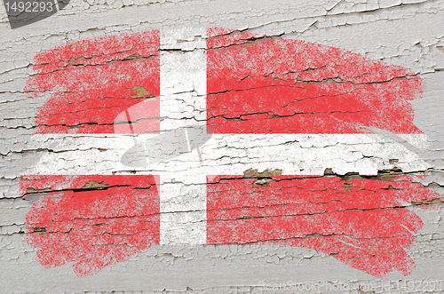 Image of flag of denmark on grunge wooden texture painted with chalk  