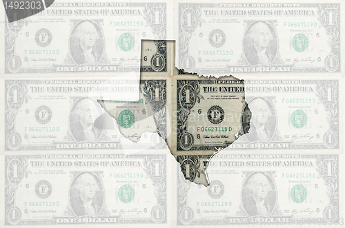 Image of Outline map of texas with transparent american dollar banknotes 