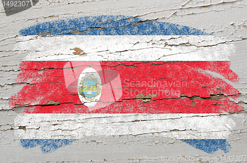 Image of flag of costa rica on grunge wooden texture painted with chalk  