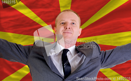 Image of happy businessman because of profitable investment in macedonia 