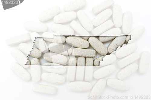 Image of Outline map of south tennessee with transparent pills in the bac