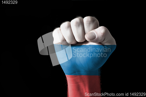 Image of Fist painted in colors of russia flag