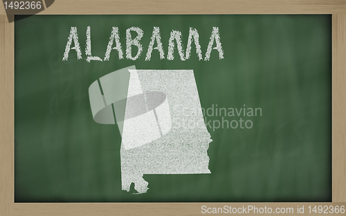 Image of outline map of alabama on blackboard 