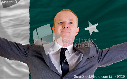 Image of happy businessman because of profitable investment in pakistan s