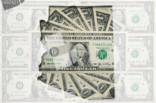 Image of Outline map of Arizona with transparent american dollar banknote