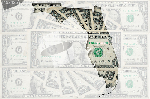 Image of Outline map of Florida with transparent american dollar banknote