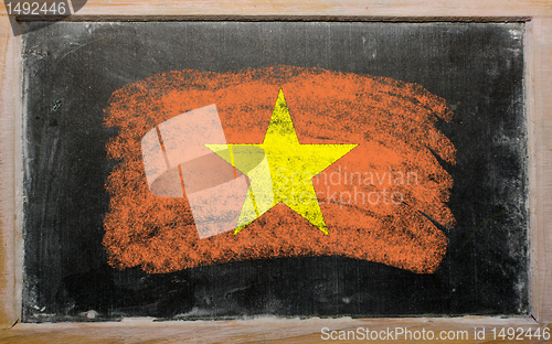 Image of flag of vietnam on blackboard painted with chalk  