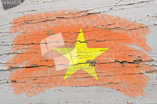 Image of flag of vietnam on grunge wooden texture painted with chalk  