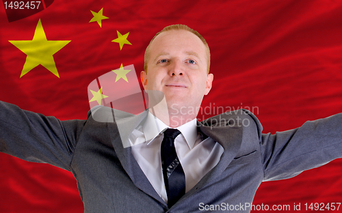 Image of happy businessman because of profitable investment in china stan