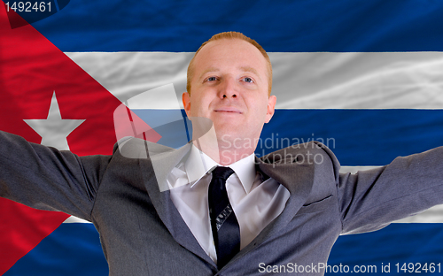 Image of happy businessman because of profitable investment in cuba stand