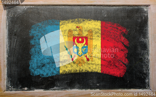 Image of flag of moldova on blackboard painted with chalk  