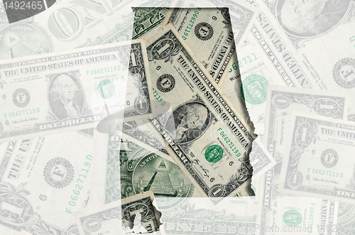 Image of Outline map of Alabama with transparent american dollar banknote