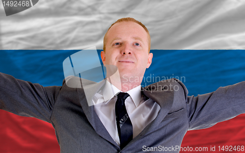 Image of happy businessman because of profitable investment in russia sta
