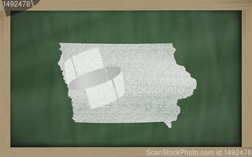 Image of outline map of iowa on blackboard 