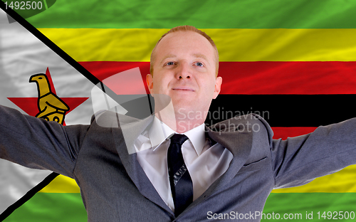 Image of happy businessman because of profitable investment in zimbabwe s