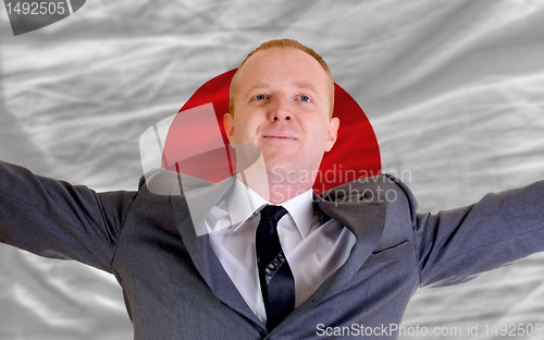 Image of happy businessman because of profitable investment in japan stan