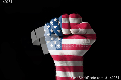 Image of Fist painted in colors of usa flag