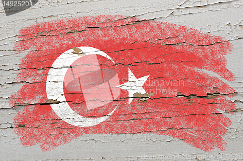 Image of flag of turkey on grunge wooden texture painted with chalk  