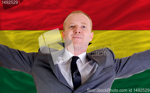 Image of happy businessman because of profitable investment in ghana stan