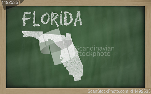 Image of outline map of florida on blackboard 