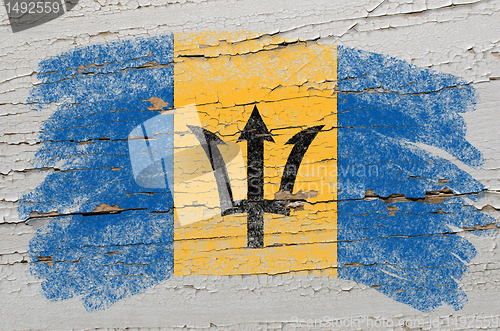 Image of flag of barbados on grunge wooden texture painted with chalk  